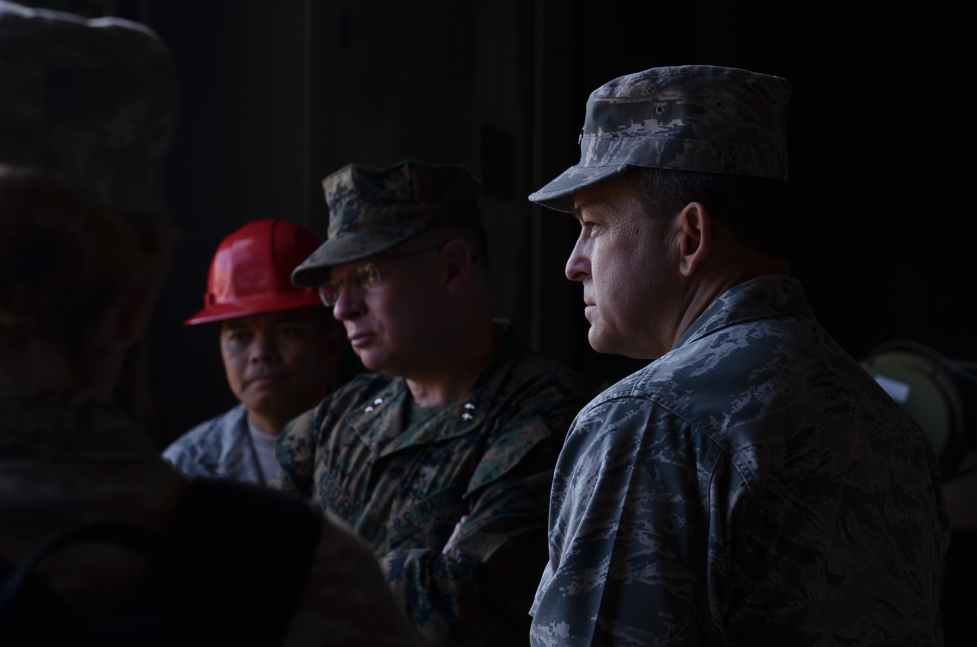 Maj. Gen. Timothy Byers, the Air Force Civil Engineer, Headquarters U.S. Air Force, listens as Airmen from the 55th RED HORSE Squadron brief current and future Pacific Regional Training Center projects on Northwest Field, Guam, Feb. 28, 2013. Byers and leaders from the U.S. Navy and U.S. Marine Corps toured base structures and developments at Andersen to gain insight on successes and challenges within Joint Region Marianas and the PRTC. (U.S. Air Force photo Staff Sgt. Alexandre Montes/Released)