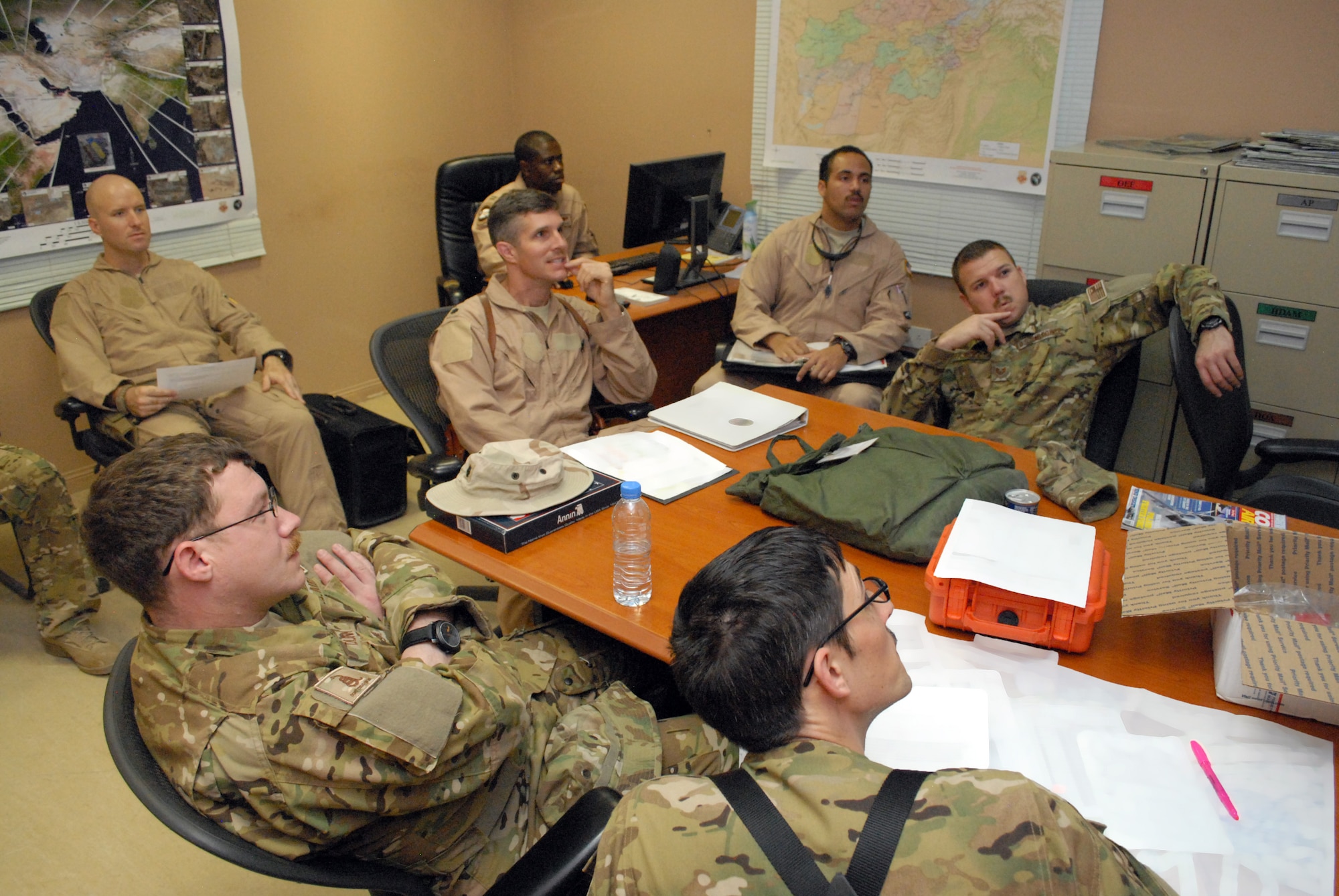SOUTHWEST ASIA -- Members of the 746th Expeditionary Airlift Squadron, comprised of Reservists from the 908th Airlift Wing, Maxwell AFB, Ala., and 440th Airlift Wing, Pope Field, N.C., receive an intelligence and tactics brief, Mar. 4, in preparation to transport cargo downrange in the U.S. Central Command area of responsibility. (U.S. Air Force photo/Master Sgt. Christian Michael)