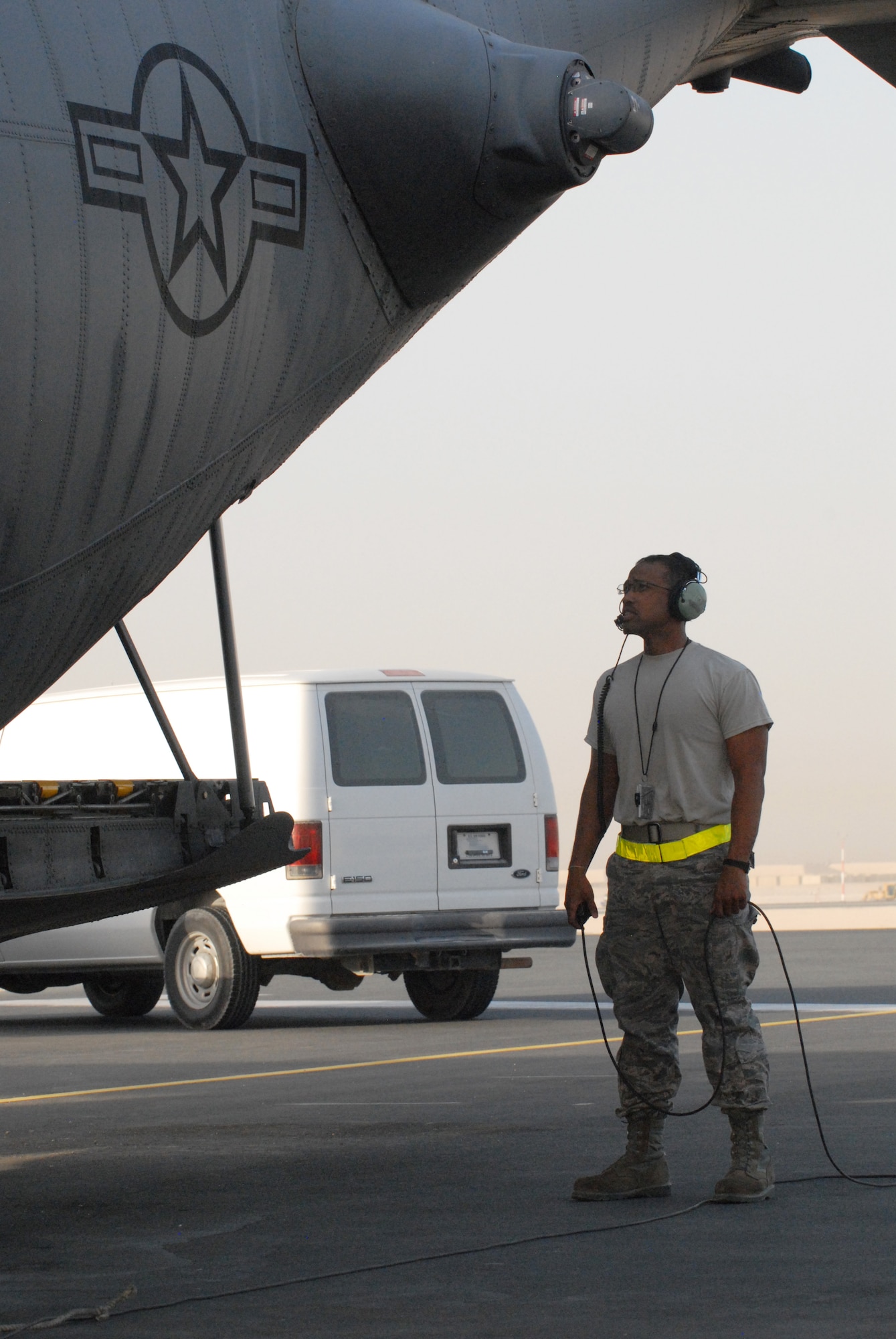 SOUTHWEST ASIA -- Senior Airman Marlin Kennedy, 746th Expeditionary Aircraft Maintenance Squadron communicates with the duty flight engineer, Mar. 4, during preflight checklists. Members of the 746th Expeditionary Airlift Squadron and EAMXS, comprised of Reservists from the 908th Airlift Wing, Maxwell AFB, Ala., and 440th Airlift Wing, Pope Field, N.C., prepare to transport cargo downrange in the U.S. Central Command area of responsibility. (U.S. Air Force photo/Master Sgt. Christian Michael)