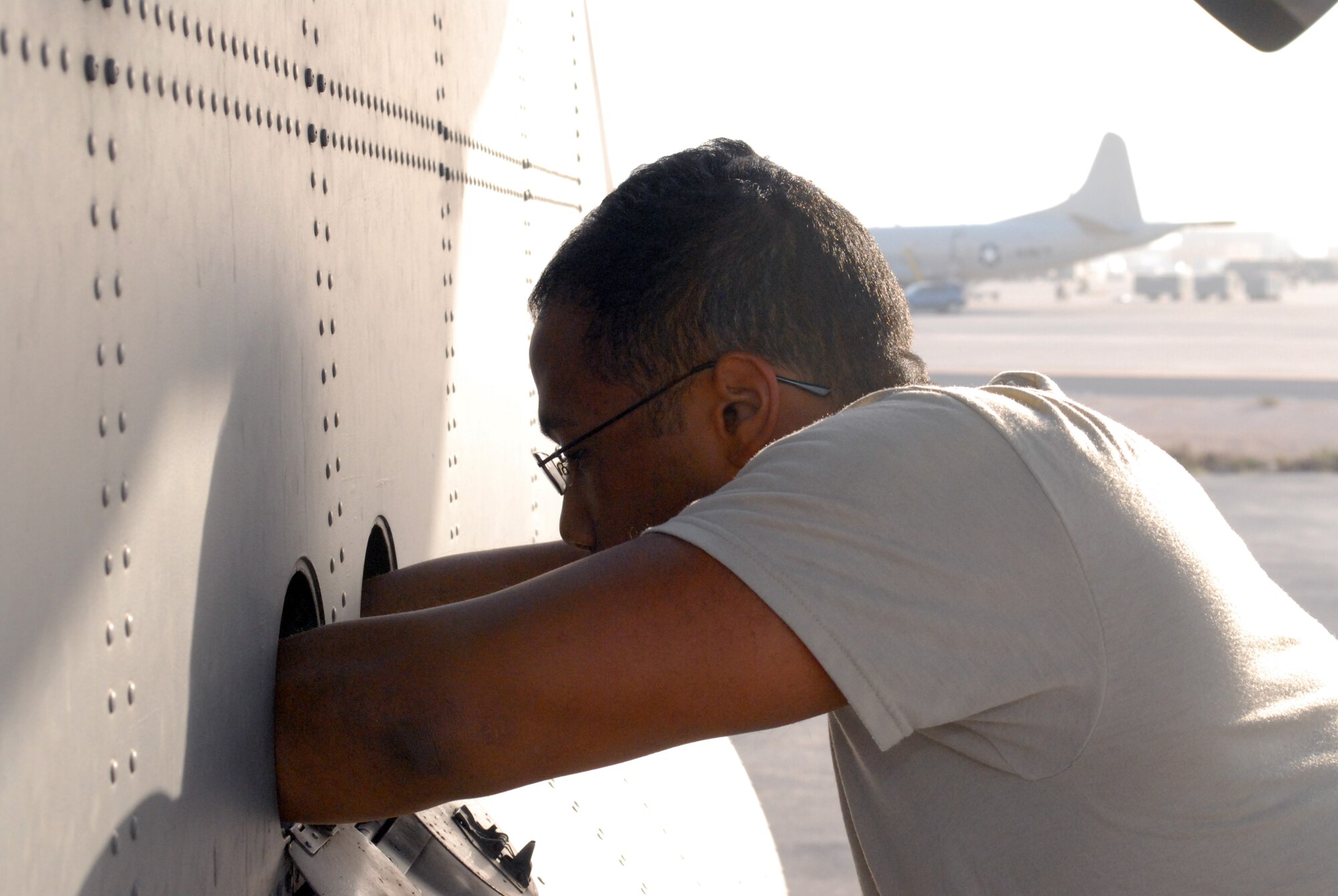 SOUTHWEST ASIA -- Master Sgt. Aubrey Walters, 746th Expeditionary Airlift Squadron duty flight engineer, runs preflight checklists, Mar. 4. Members of the 746th EAS and Expeditionary Aircraft Maintenance Squadron, comprised of Reservists from the 908th Airlift Wing, Maxwell AFB, Ala., and 440th Airlift Wing, Pope Field, N.C., prepare to transport cargo downrange in the U.S. Central Command area of responsibility. (U.S. Air Force photo/Master Sgt. Christian Michael)