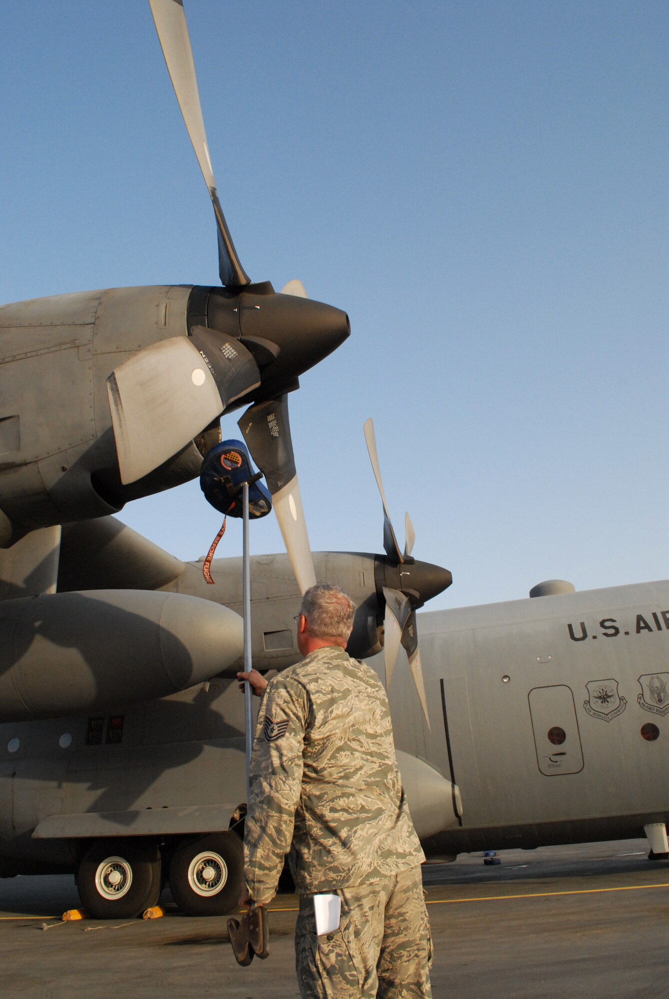 SOUTHWEST ASIA -- Tech. Sgt. Robert Kenning, 746th Expeditionary Aircraft Maintenance Squadron, shifts rotor blades to remove an intake cover from a C-130 engine, Mar. 4. Members of the 746th Expeditionary Airlift Squadron and EAMXS comprised of Reservists from the 908th Airlift Wing, Maxwell AFB, Ala., and 440th Airlift Wing, Pope Field, N.C., prepare to transport cargo downrange in the U.S. Central Command area of responsibility. (U.S. Air Force photo/Master Sgt. Christian Michael)