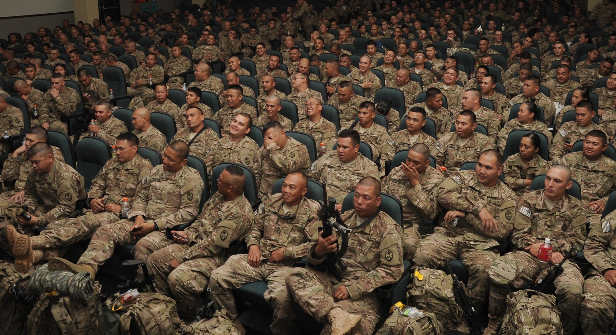 Members of the Guam Army National Guard, 1st Battalion, 294th Infantry Regiment wait for roll call on Andersen Air Force Base, Guam, March 2, 2013, in preparation for a deployment to Afghanistan. The 36th Logistics Readiness Squadron served as the lead organization in executing the logistical portion of deploying about 600 Soldiers. (U.S. Air Force photo by Airman 1st Class Adarius Petty/Released)
