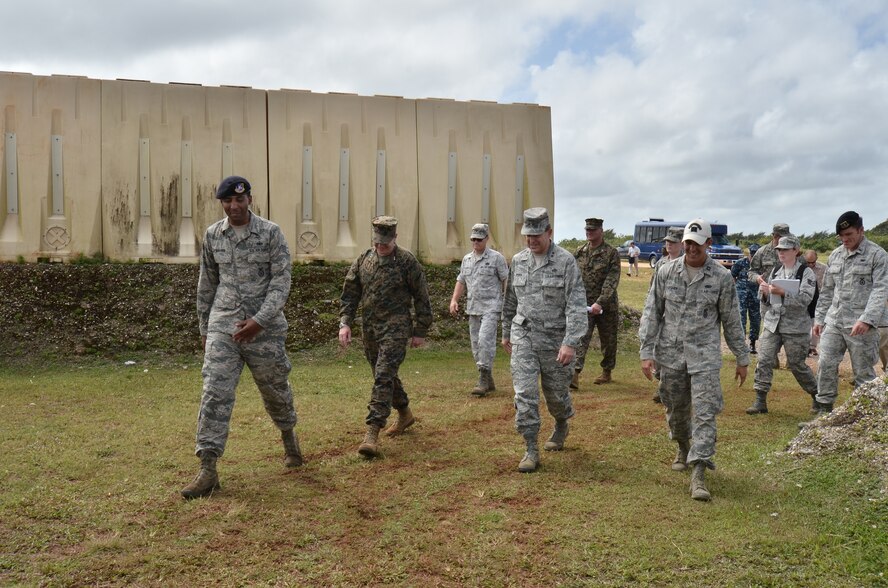 U.S. Air Force, Marine Corps and Navy headquarters leadership take a tour of the Pacific Regional Training center on Northwest Field, Guam, Feb. 27, 2013. The leaders toured base structures and developments to gain insight on successes and challenges within Joint Region Marianas. (U.S. Air Force photo Staff Sgt. Alexandre Montes/Released)