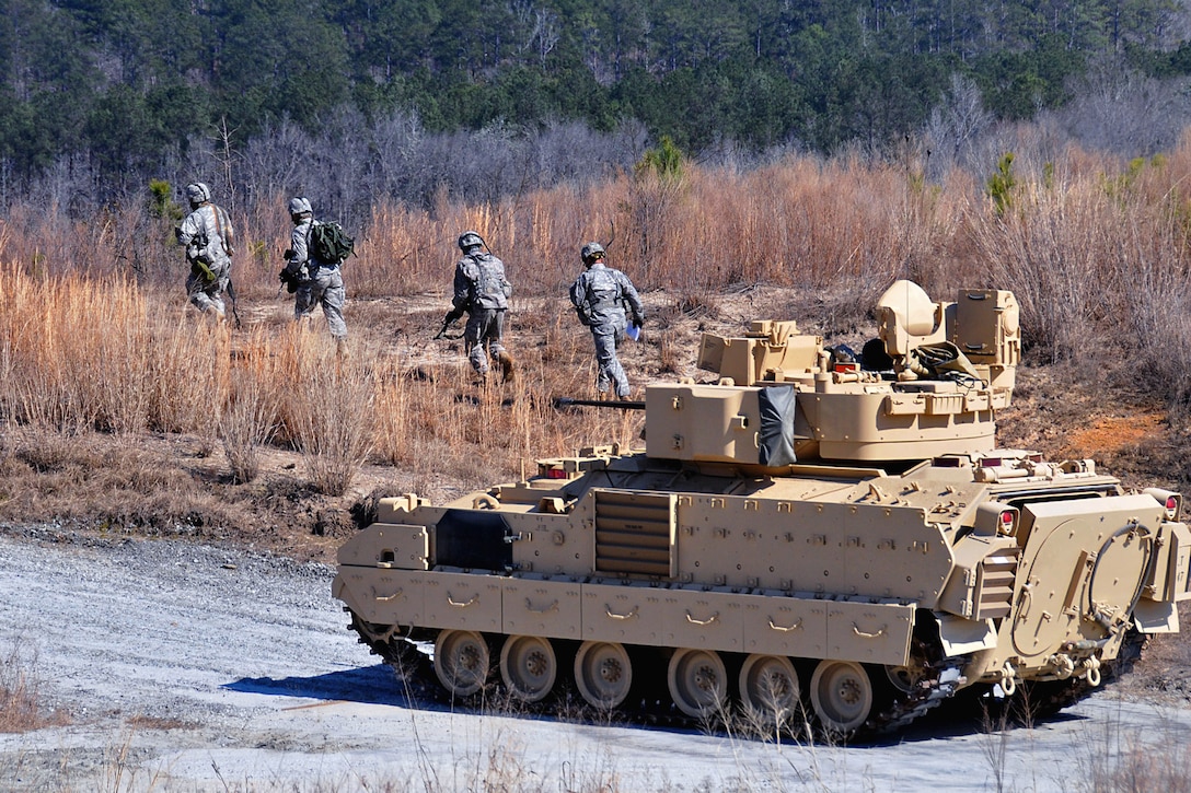 One of the Army's top cavalry scout teams disembarks a Bradley fighting ...