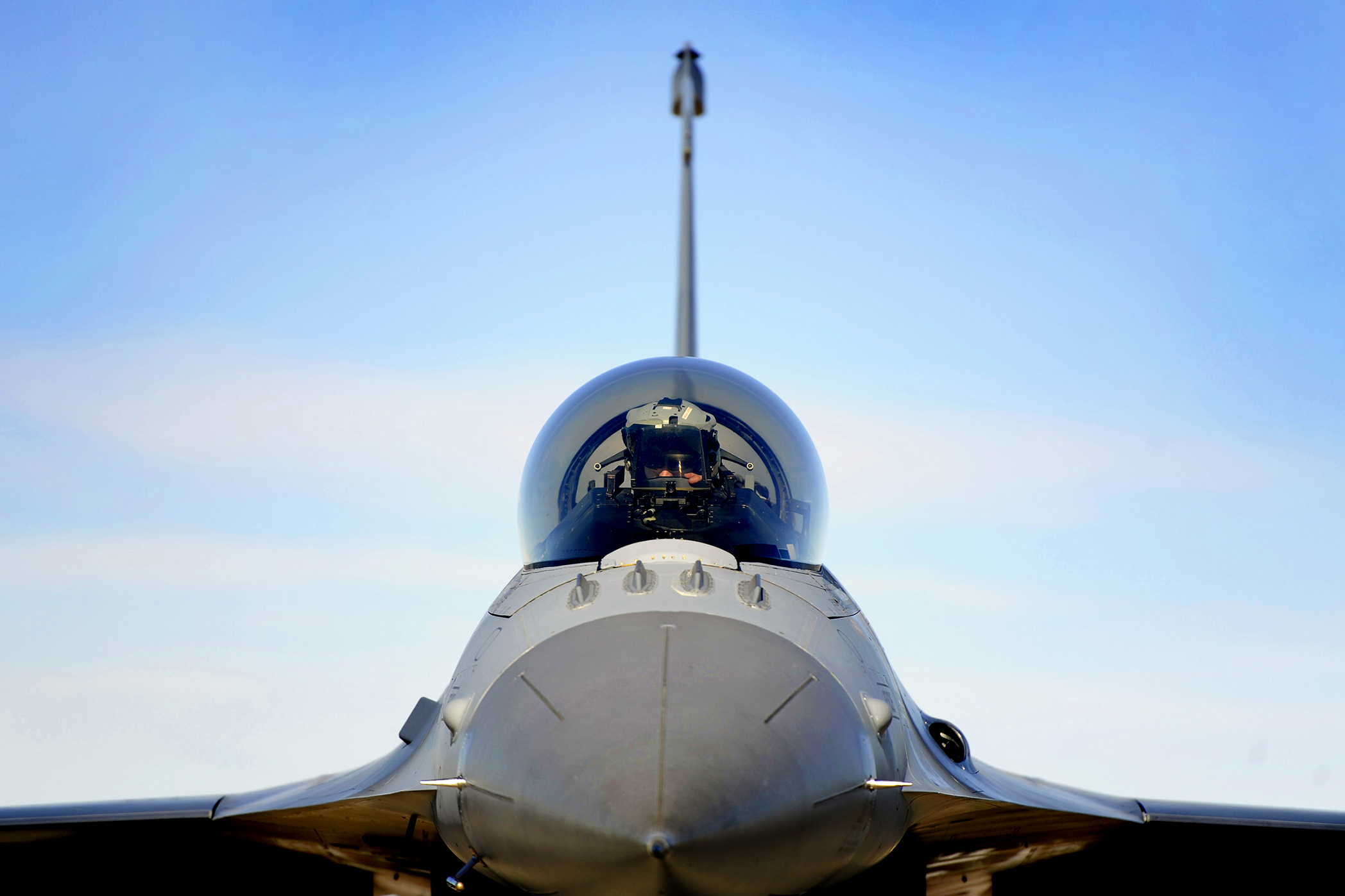 A U S Air Force Pilot Sits In The Cockpit Of An F 16 Fighting Falcon Aircraft