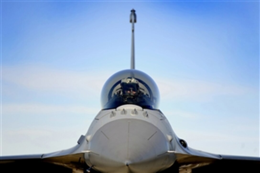 A U.S. Air Force pilot from the 79th Fighter Squadron gets situated in the cockpit of his F-16 Fighting Falcon prior to takeoff for exercise Red Flag at Nellis Air Force Base, Nev., on Feb. 25, 2012.  