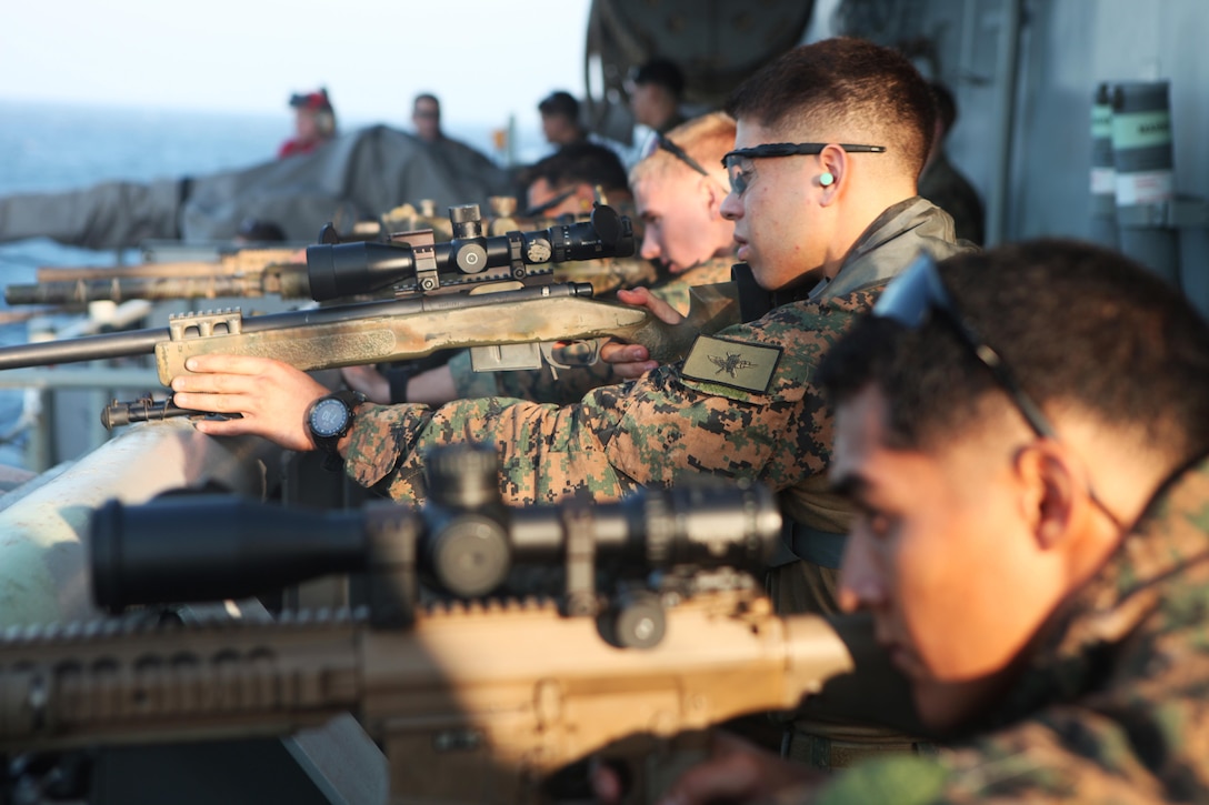 Marines with the Amphibious and Force Reconnaissance Platoons of the Maritime Raid Force, 31st Marine Expeditionary Unit, fire M110 Semi-Automatic Sniper Systems and M40A5 sniper rifles at targets from the stern of the ship here, March 6. The snipers of the MRF conducted marksmanship training to keep their skills sharp for any contingency operation they may be called upon to execute. The 31st MEU is the only continuously forward-deployed MEU and is the Marine Corps’ force in readiness in the Asia-Pacific region.