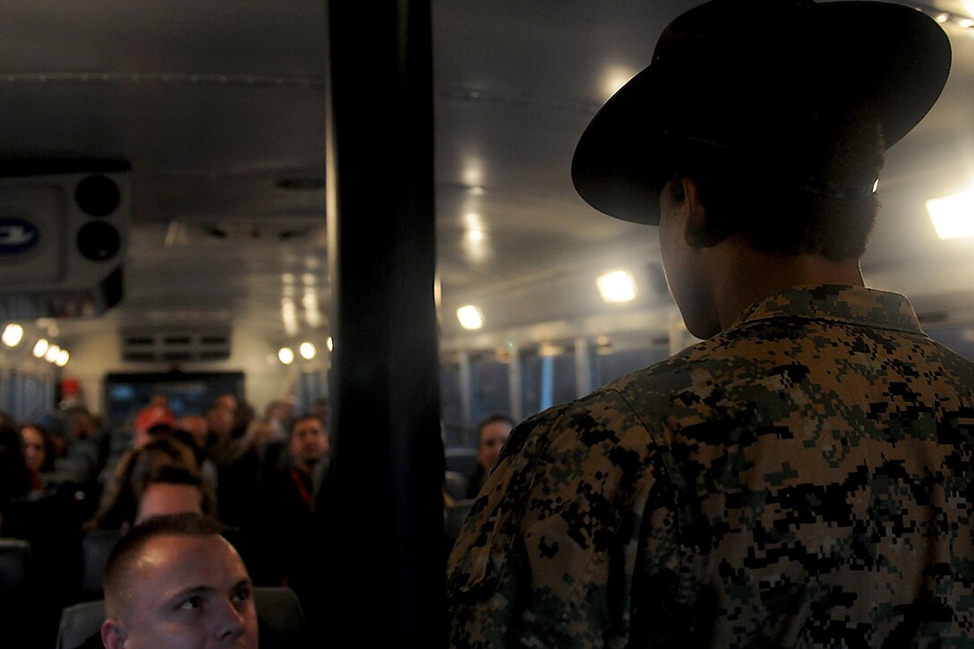 Staff Sergeant Latoya Moffet, a receiving senior drill instructor, briefs a new batch of educators from RS Nashville to start off the Educators Workshop aboard Parris Island, S.C., March 6, 2013. Educators from the surrounding areas visit Parris Island to participate in a three-day boot camp to gain a better understanding of the Marine Corps. (U.S. Marine Corps photo by Pfc. John-Paul Imbody)