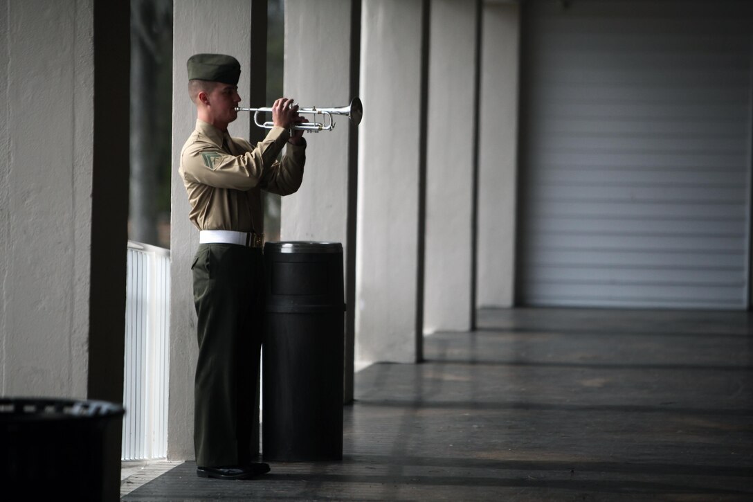 A bugler plays “Taps” during a memorial service held for Cpl. Christopher M. Monahan Jr. and Lance Cpl. Dale W. Means, motor transportation operators with Combat Logistics Battalion 2, 2nd Marine Logistics Group, aboard Camp Lejeune, N.C., Feb. 22, 2013. Monahan and Means were killed while supporting combat operations in Helmand province, Afghanistan, November 2012. 