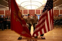 Marines stand before a memorial for Cpl. Christopher M. Monahan Jr. and Lance Cpl. Dale W. Means, motor transportation operators with Combat Logistics Battalion 2, 2nd Marine Logistics Group, set up aboard Camp Lejeune, N.C., Feb. 22, 2013. The two Marines were killed while supporting combat operations in Helmand province, Afghanistan, November 2012. 