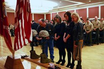 Family members mourn at a memorial set up for two fallen Marines who served with Combat Logistics Battalion 2, 2nd Marine Logistics Group during the unit’s 2012 deployment to Helmand province, Afghanistan. The unit held the memorial aboard Camp Lejeune, N.C., where the families and friends of the fallen Marines joined the unit in honoring the sacrifices of the two servicemembers. 