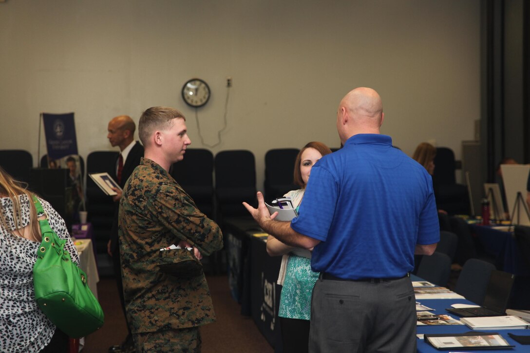 Cpl. Chris hulsey attends the Marine Corps Community Services monthly job fair at the training and education building Feb. 15. Every month MCCS invites schools and business owners to come and present their job openings to all military and civilians aboard the air station. Some of the business and schools include the Greensboro Police Department, Park University and East Carolina University. MCCS even opens up a booth to showcase their many jobs they have available to the public.