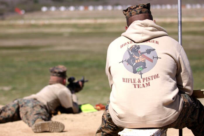 Sgt. Ronald Castillo, right, records shot impact areas for Gunnery Sgt. Erick Lee, during the Western Division Matches held at Wilcox Range here March 6. 

Castillo is a legal clerk with Marine Wing Support Squadron 373, Miramar, and Lee is a fuels chief with the same unit. The Marines are two of 328 shooters that make up the 63 teams in this year’s competition.
