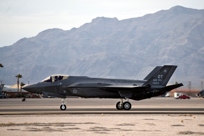 One of two Lockheed Martin F-35 Lighting IIs lands at Nellis Air Force Base, Nev., March 6, 2013. The aircraft, assigned to the 422nd Test and Evaluation Squadron, has a maximum speed of more than Mach 1.6. (U.S. Air Force photo by Airman 1st Class Christopher Tam)