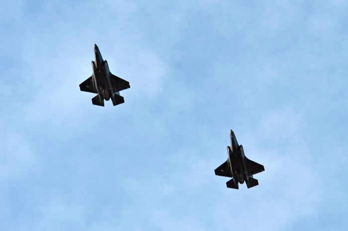 Two Lockheed Martin F-35 Lightning II aircraft fly over Nellis Air Force Base, Nev., prior to landing March 6, 2013. The Lockheed Martin F-35 Lightning II is a single-seat, single-engine, fifth generation, multirole fighter that’s able to perform ground attack, reconnaissance, and air defense missions with stealth capability. (U.S. Air Force photo by Airman 1st Class Jason Couillard)