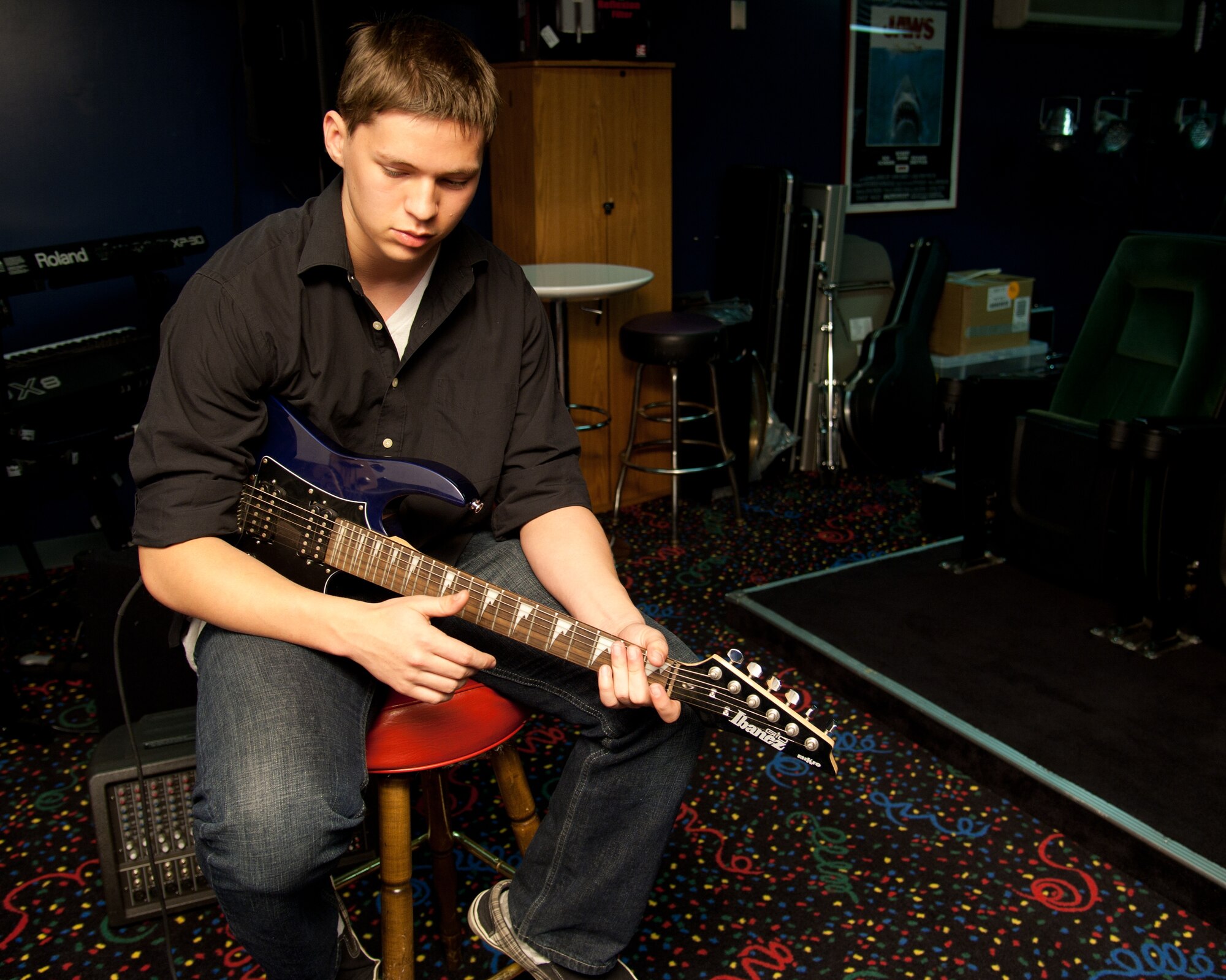 YOKOTA AIR BASE, Japan – Jarred Garcia, 17, demonstrates his guitar skills at the Yokota Teen Center.  Garcia said he plans to learn how to play the bass next.  "I believe you should never stop learning, there’s always something you can always do,” Garcia said.  (U.S. Air Force photo by Airman 1st Class Soo C. Kim)