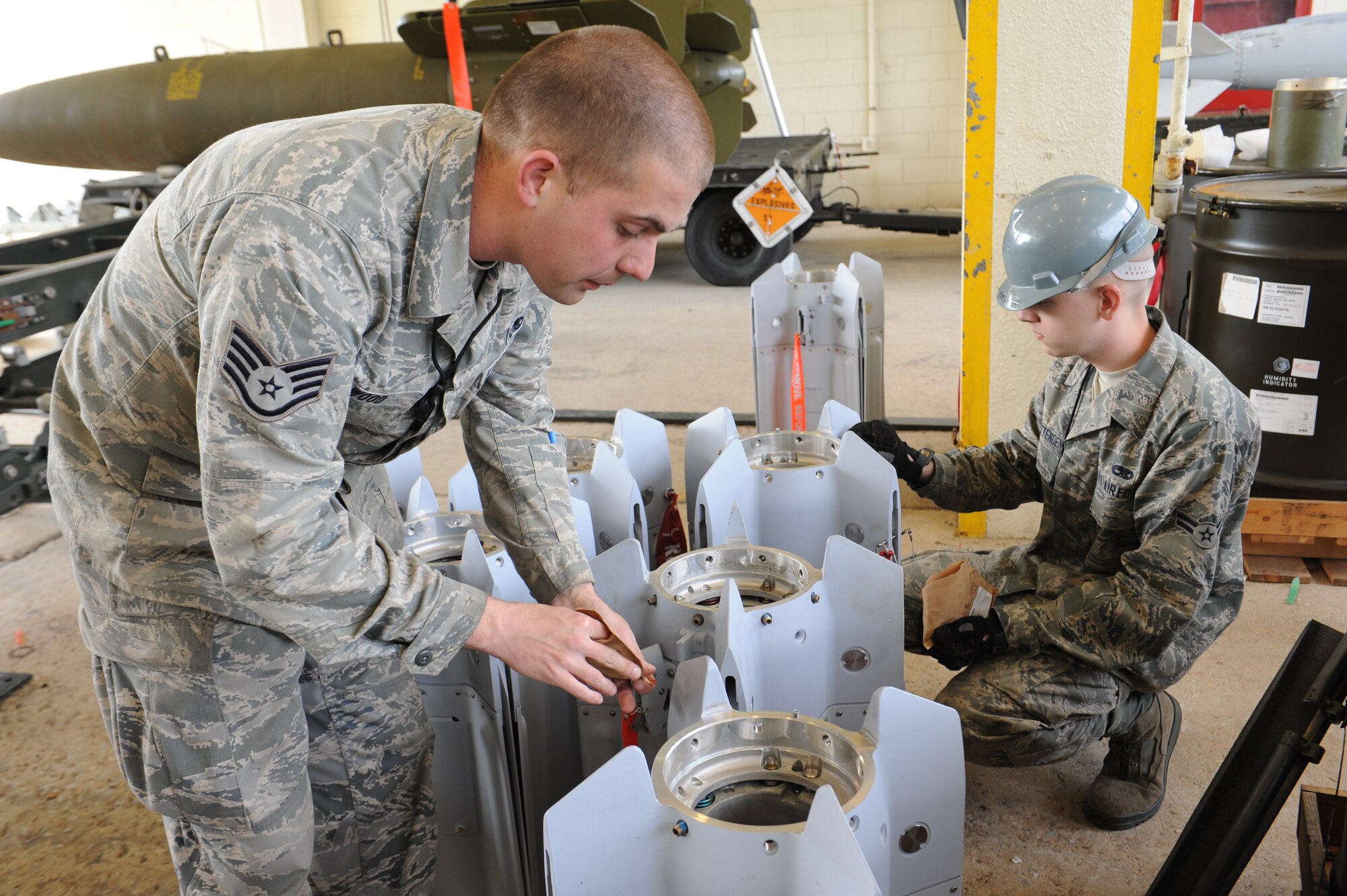 U.S. Air Force Airmen put screws into the tails of guided bomb unit 12 bombs during a combat ammunition production exercise on Kadena Air Base, Japan, March 5, 2013. Units from around Air Combat Command and Pacific Air Forces participated in the exercise to test the munitions Airmen’s ability to build ammunition for wartime aircraft. (U.S. Air Force photo/Airman 1st Class Malia Jenkins)
