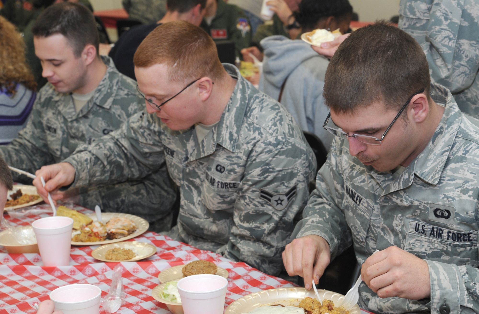 Volunteers from the 8th Flying Training Squadron prepared 186 dinners for Airmen and family members who attended the monthly Singles’ International Gourmet Meal Opportunity, March 4, at Vance Air Force Base, Okla. (U.S. Air Force photo/ Airman 1st Class Frank Casciotta)