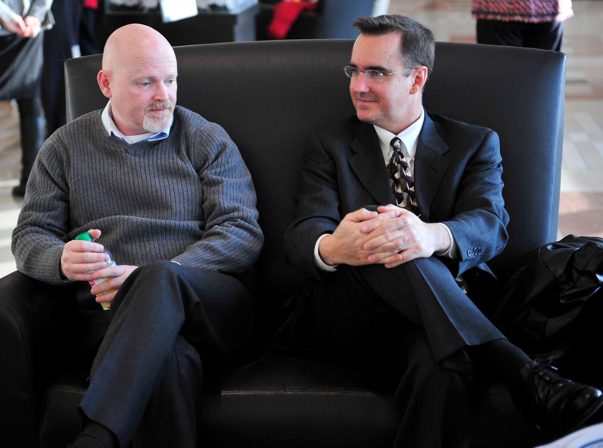 Joe Elms, Air Force Space Command community planner, left, and Mark Gillem, urban planner with The Urban Collaborative who worked as a lead on the Master Plan, converse about the details of the plan for development of Buckley Air Force Base March 4, 2013, at the Aurora City Building in Aurora, Colo. The plan outlines the base development during the next five, 10 and 20 years. (U.S. Air Force photo by Airman 1st Class Darryl Bolden Jr./Released)     