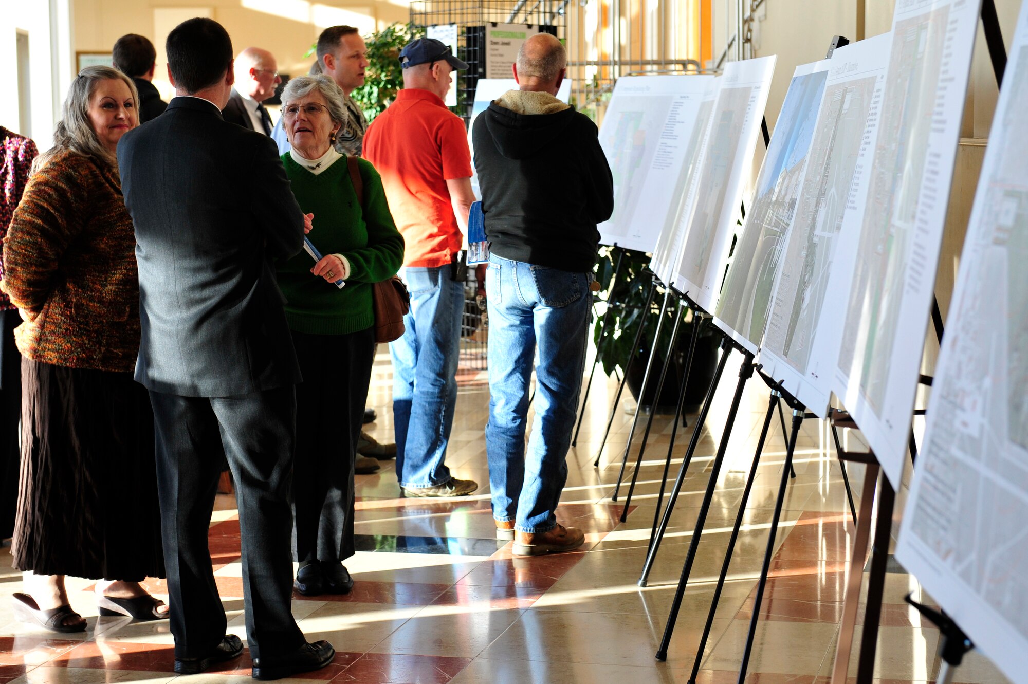 Members of the local community and Team Buckley view displays of the Master Plan for development of the installation March 4, 2013, at the Aurora City Building in Aurora, Colo. The plan incorporated almost a year’s worth of work by military and community members. (U.S. Air Force photo by Airman 1st Class Darryl Bolden Jr./Released)