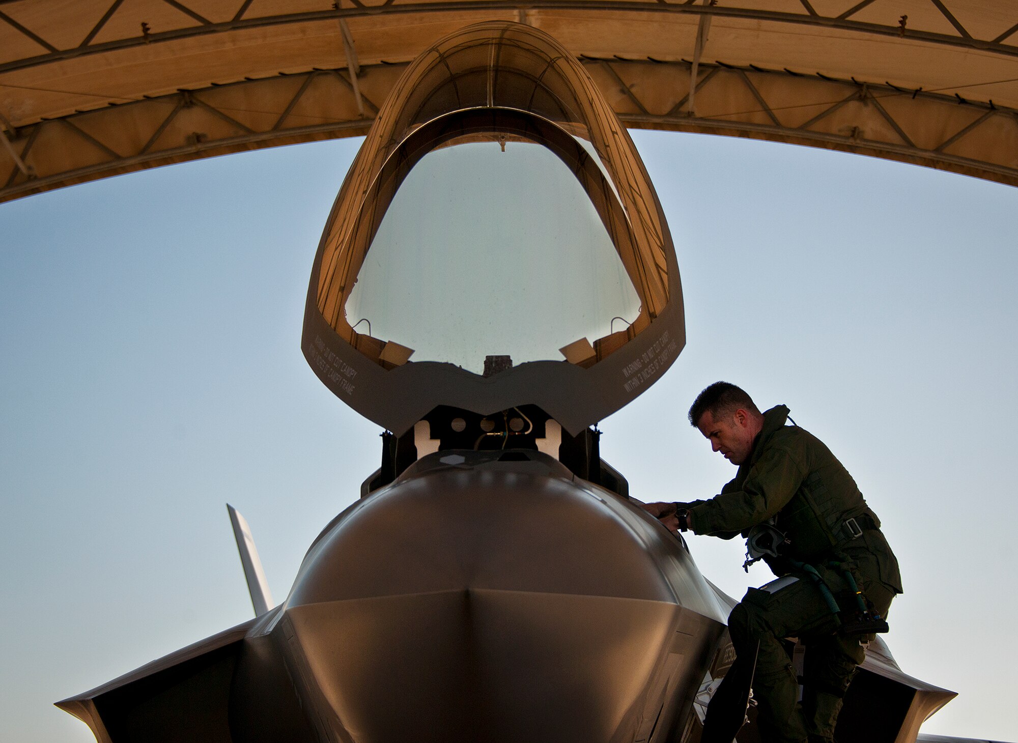 Lt. Col. Benjamin Bishop, the 422nd Test and Evaluation Squadron director of operations, climbs into an F-35A Lightning II at Eglin Air Force Base, Fla., March 6 for his first sortie in the new aircraft.  Bishop is among the first pilots to begin the official training that began in January.  Bishop and other 422nd TES pilots will begin operational testing of the joint strike fighter later this year at Nellis Air Force Base, Nev.  (U.S. Air Force photo/Samuel King Jr.)