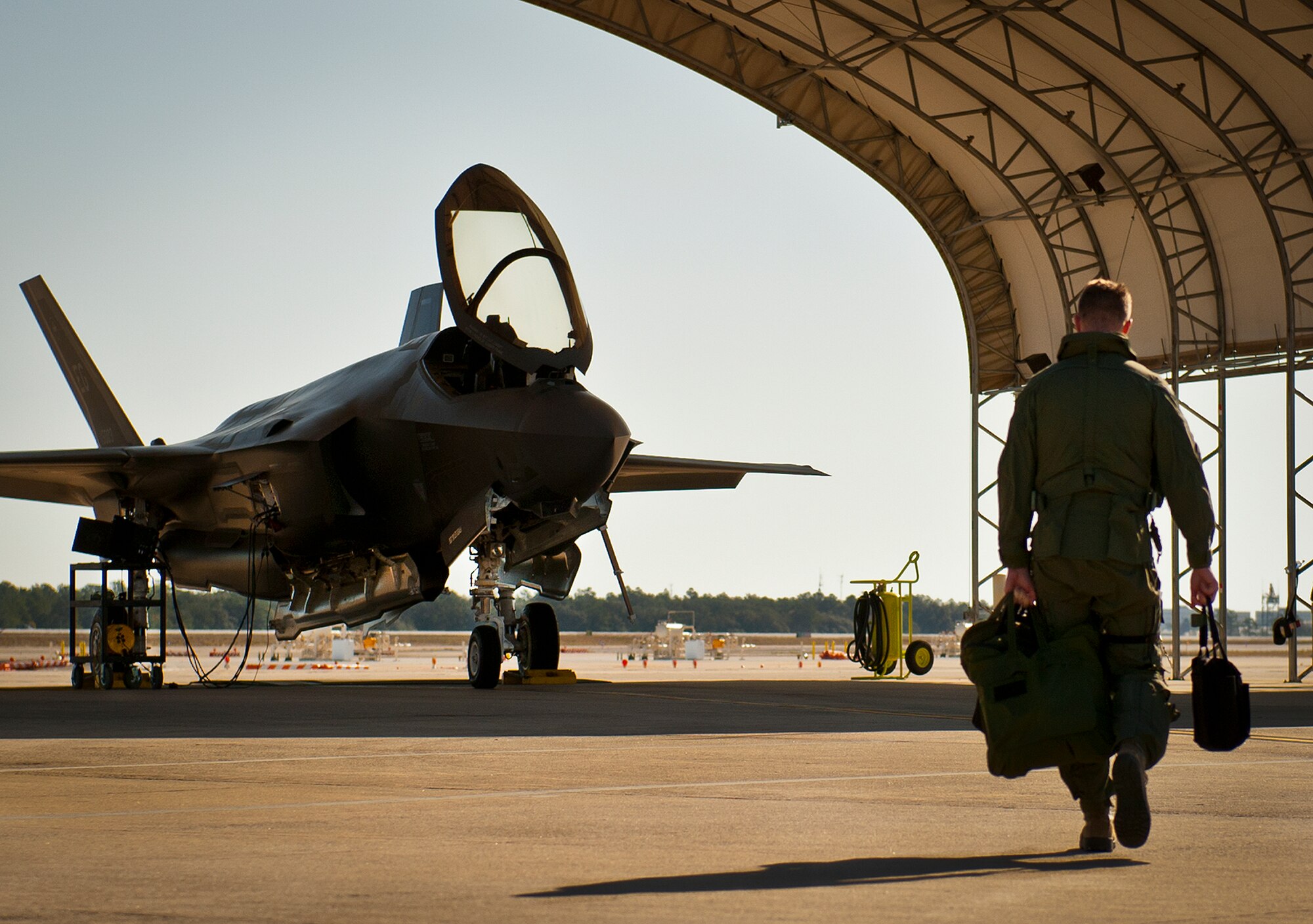 Lt. Col. Benjamin Bishop, the 422nd Test and Evaluation Squadron director of operations, walks toward an F-35A Lightning II at Eglin Air Force Base, Fla., March 6 for his first sortie in the new aircraft.  Bishop is among the first pilots to begin the official training that began in January.  Bishop and other 422nd TES pilots will begin operational testing of the joint strike fighter later this year at Nellis Air Force Base, Nev.  (U.S. Air Force photo/Samuel King Jr.)