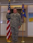 CMSgt Ronald Beadles takes the oath as a new Chief Master Sergeant in medical group promotion ceremony.