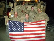 SSgt Christeana Schwartz, medical technician from the 341st Medicla Group, poses with her team in the AOR.