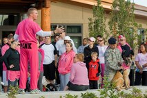 Mr Kirk Clark proud in pink addresses the crowd at Breast Cancer Awareness event.  Mr. Clark is an exercise physiologist with the Medical Group Health and Wellness Center.