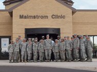 Medical Group 4A and MSC staff pose with BG MIller and CMSgt Wagner