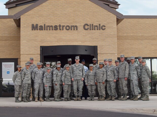 Medical Group 4A and MSC staff pose with BG MIller and CMSgt Wagner