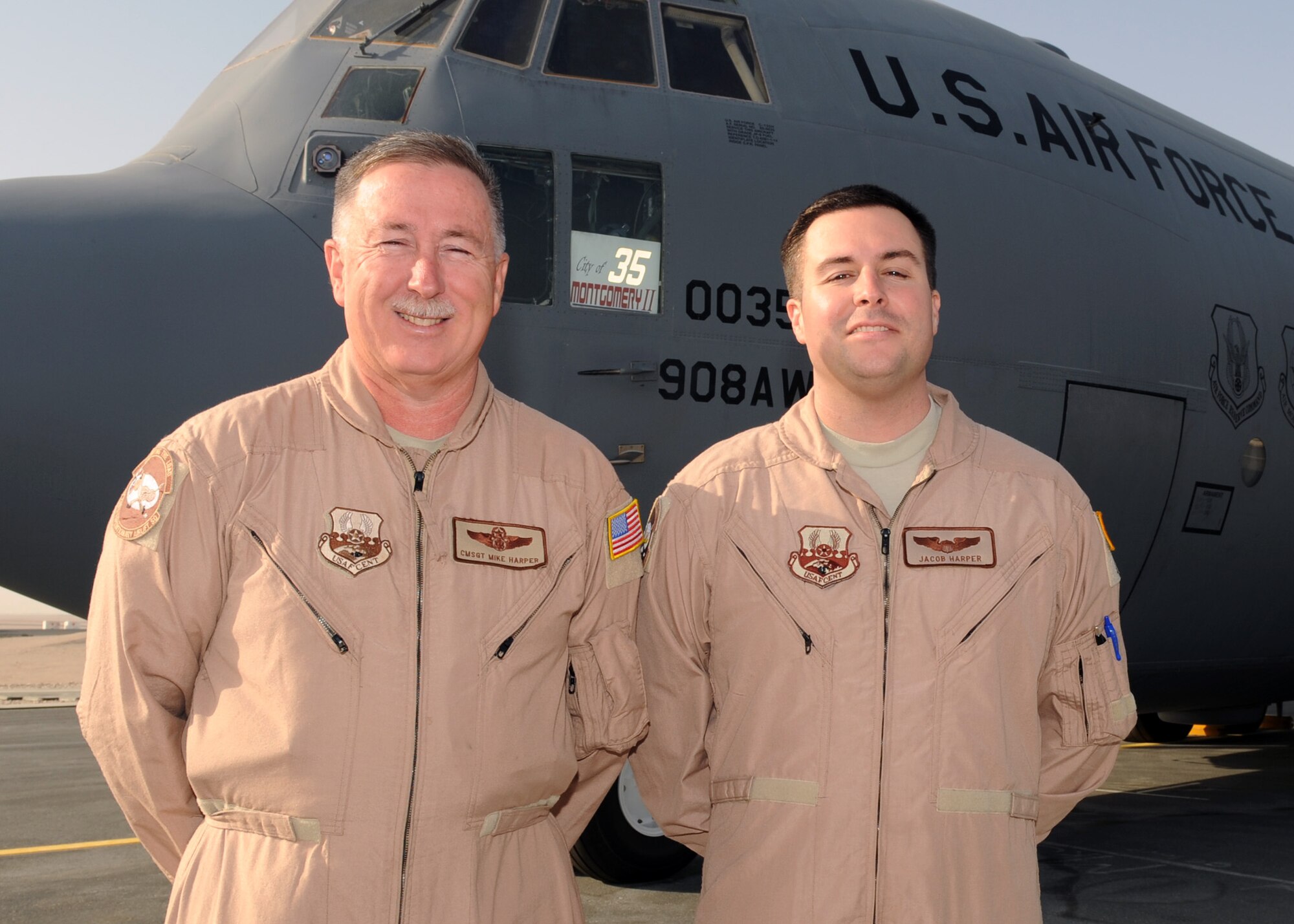 Chief Master Sgt. Michael E. Harper (left) and his son, Capt. Michael J. Harper, are deployed for the third time together with the 746th Expeditionary Airlift Squadron. This is the chief’s final deployment, as he will retire in August after 36 years. Both Airmen are Reservists deployed from the 908th Airlift Wing at Maxwell Air Force Base Ala. (U.S. Air Force photo/Senior Airman Joel Mease)