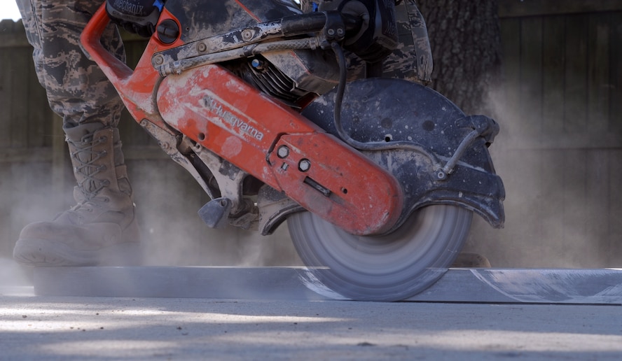 Airman 1st Class Cameron Kruell, 2nd Civil Engineer Squadron Heavy Repair Section, operates a K-12 saw on Barksdale Air Force Base, La., March 6. Heavy repair Airmen, known as "Dirt Boys," use a variety of heavy equipment such as front-end loaders, bulldozers and backhoes to accomplish a number of tasks around the base. (U.S. Air Force photo/Airman 1st Class Benjamin Gonsier)
