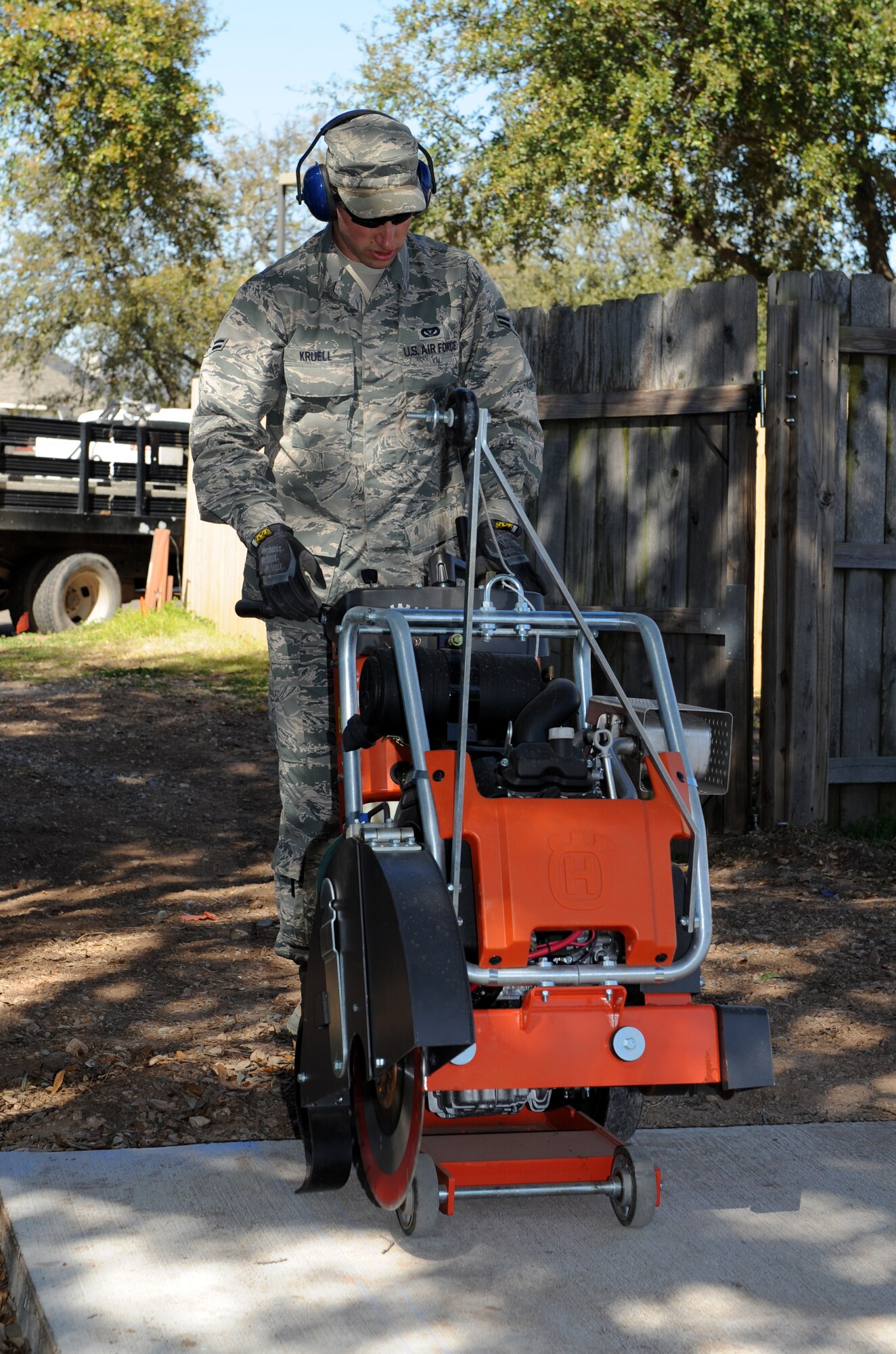 Airman 1st Class Cameron Kruell, 2nd Civil Engineer Squadron Heavy Repair Section, operates a walk behind saw on Barksdale Air Force Base, La., March 6. The saw is a heavy duty power tool used to cut through hard materials like concrete. (U.S. Air Force photo/Airman 1st Class Benjamin Gonsier)
