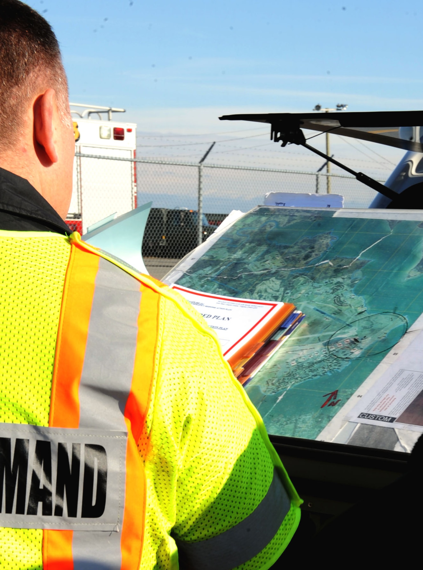Members of the 633rd Civil Engineering Squadron establish a control center during a fuel spill exercise at Langley Air Force Base, Va., Feb. 28, 2013. A map on the area containing the spill will be made by the incident commander at the control center. (U.S. Air Force photo by Senior Airman Brittany Paerschke-O’Brien/ Released)
