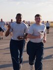 Team Malmstrom members approach the finish line during a medical group sponsored fitness run.