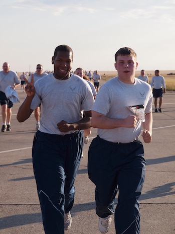 Team Malmstrom members approach the finish line during a medical group sponsored fitness run.