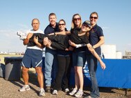 341st Medical Group Health and Wellness Center team ham it up for the camera during a medical group sponsored fitness run.