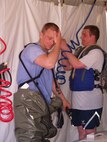 SSgt Jones and SrA Wagner work on In-Place Patient Decontamination tent between mass casualty patients during a medical group exercise
