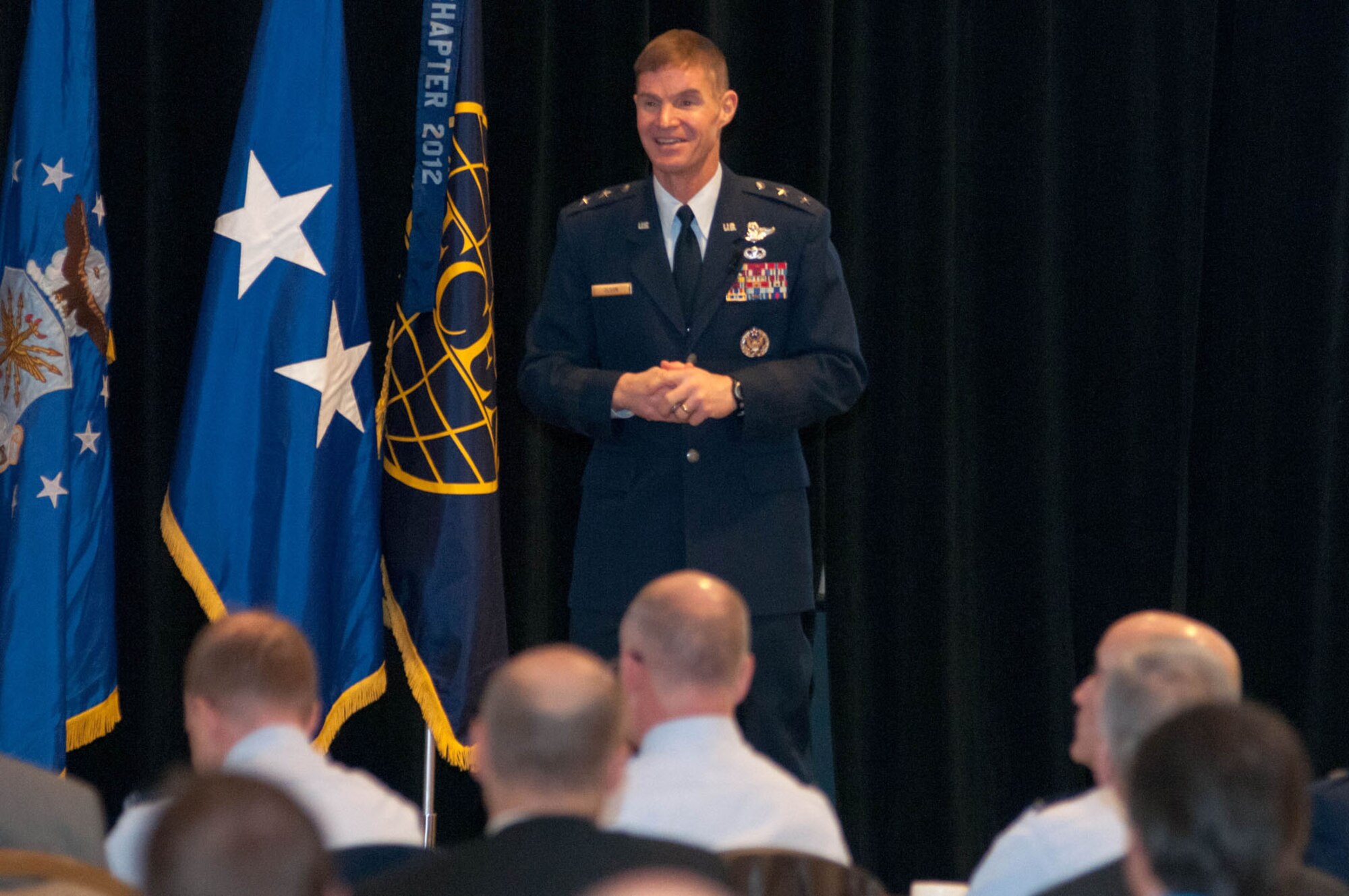 NEWTON, Mass. - Maj. Gen. Craig Olson, C3I and Networks program executive officer, addresses attendees during the New Horizons Symposium at the Marriot Hotel March 5. The symposium provides a forum for Life Cycle Management Center PEOs and program managers to exchange information with industry and is sponsored by the Lexington-Concord Chapter of the Armed Forces Communications and Electronics Association. (U.S. Air Force photo by Rick Berry)