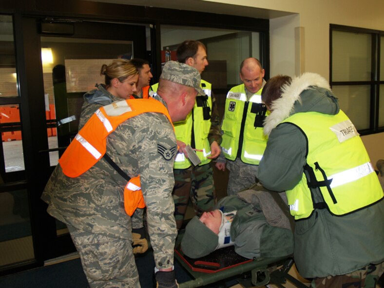Medical Group triage team receives and processes a patient during a mass casualty exercise.