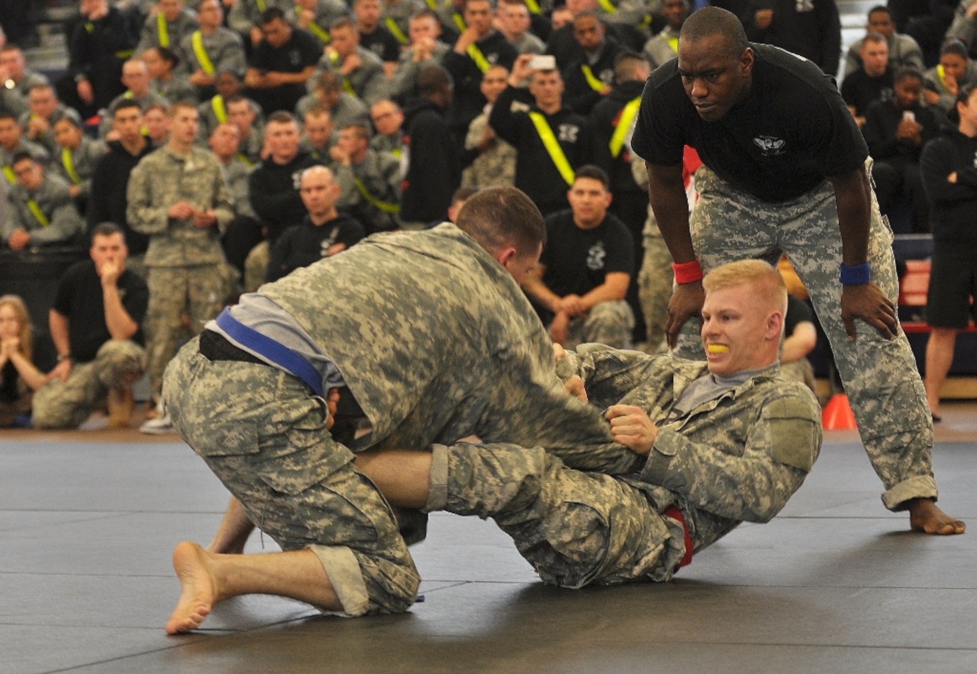 (From left) U.S. Army Pvt. Alexander May battles Pfc. Barry Remillard, both assigned to C Company, in the welterweight class final match during the 1st Battalion, 222nd Aviation Regiment's biannual combatives tournament at Anderson Field House at Fort Eustis, Va., Feb. 23, 2013. Remillard defeated May to win the welterweight class title. (U.S. Air Force photo by Senior Airman Jason J. Brown/Released)