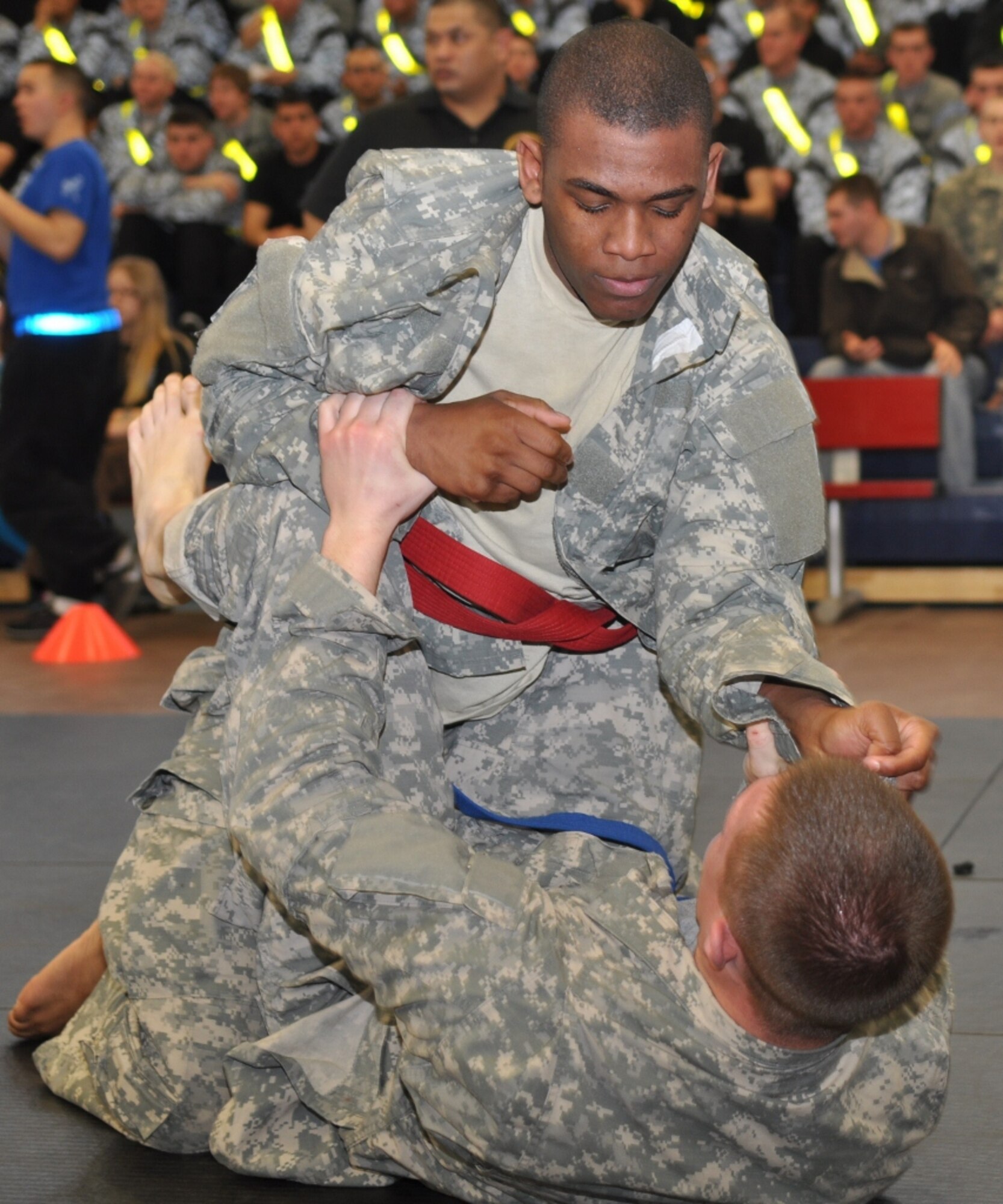U.S. Army Pfc. Michael Trombley, assigned to C Company, attempts to overtake an opponent during the 1st Battalion, 222nd Aviation Regiment's biannual combatives tournament at Anderson Field House at Fort Eustis, Va., Feb. 23, 2013. D Co. took top honors at the event, scoring 33 points from their competitor's matches. (U.S. Air Force photo by Senior Airman Jason J. Brown/Released)