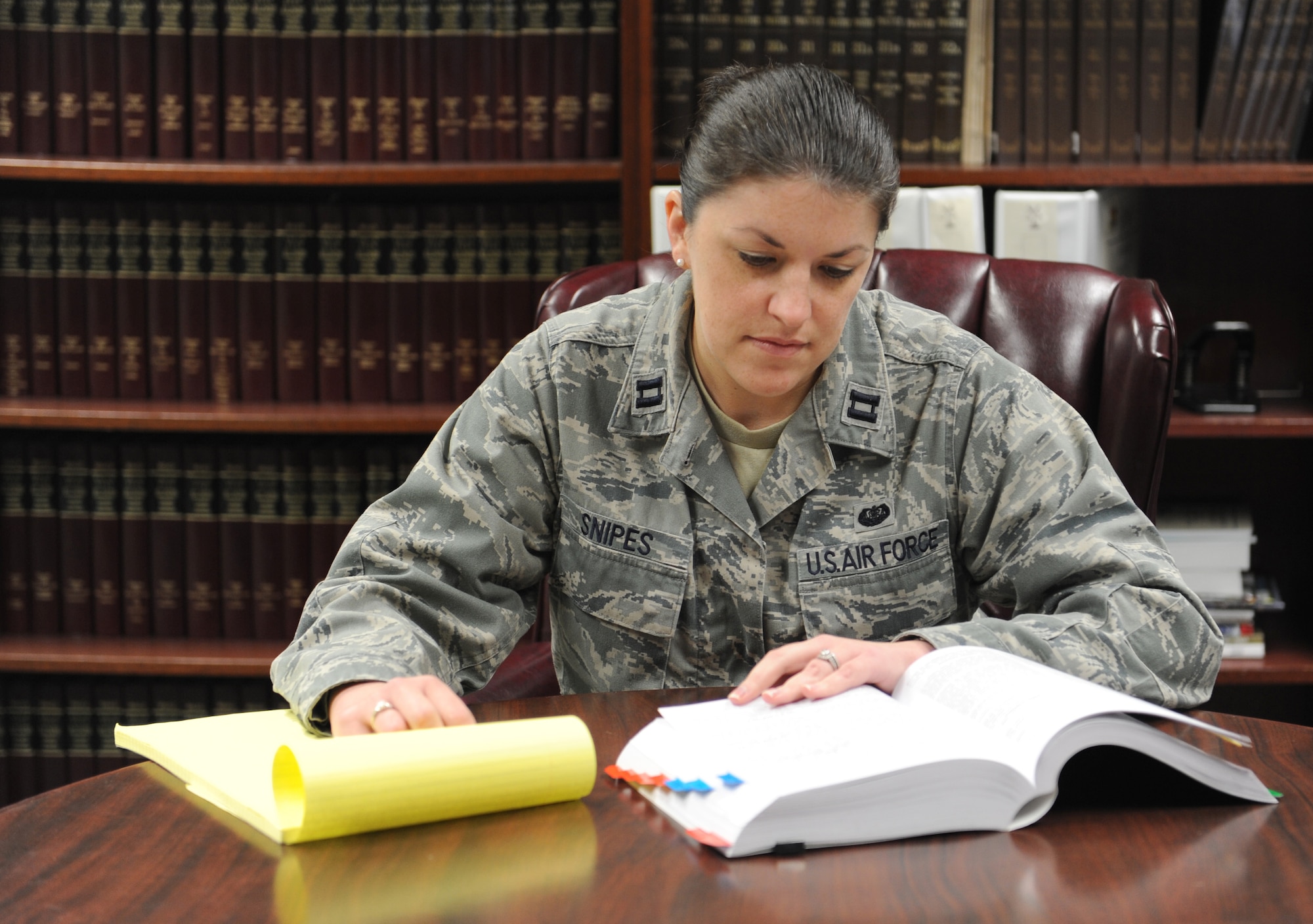 Capt. Amanda Snipes, 375th Air Mobility Wing general law chief and special victims' counsel, conducts research on sexual offense cases at Scott AFB March 1.  As an SVC, her job is to provide sexual assault victims with guidance and legal representation throughout the criminal proceeding.  (U.S. Air Force photo/Staff Sgt. Maria Bowman)