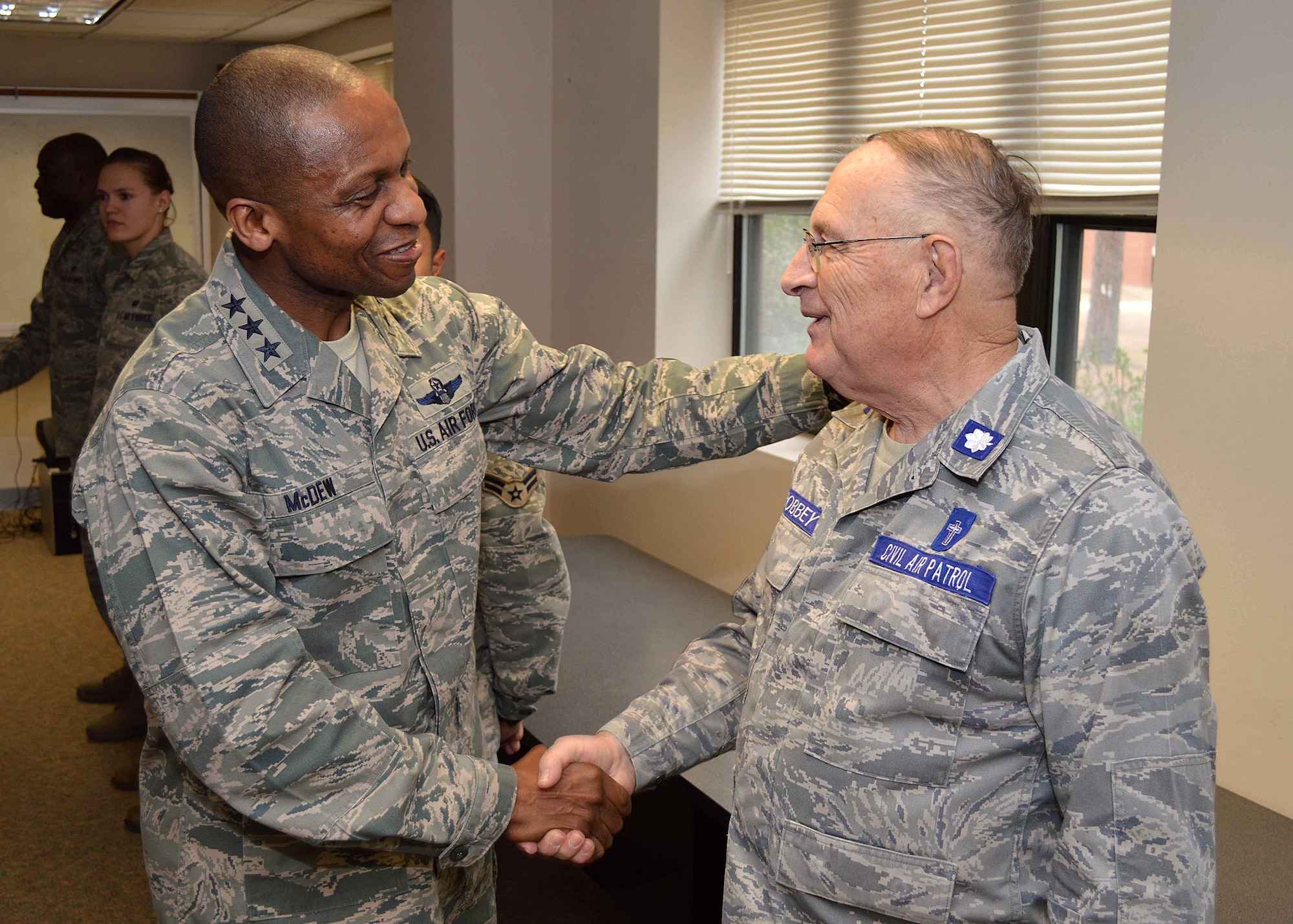 Lt. Gen. Darren McDew, 18th Air Force commander, greets Chaplain (Lt. Col.) Dave Bobbey, Civil Air Patrol, during his tour of 43rd Airlift Group units Feb 28.  General McDew visited Pope Army Airfield, N.C. to see first-hand how 43rd Airlift Group Airmen support the Global Response Force mission.
