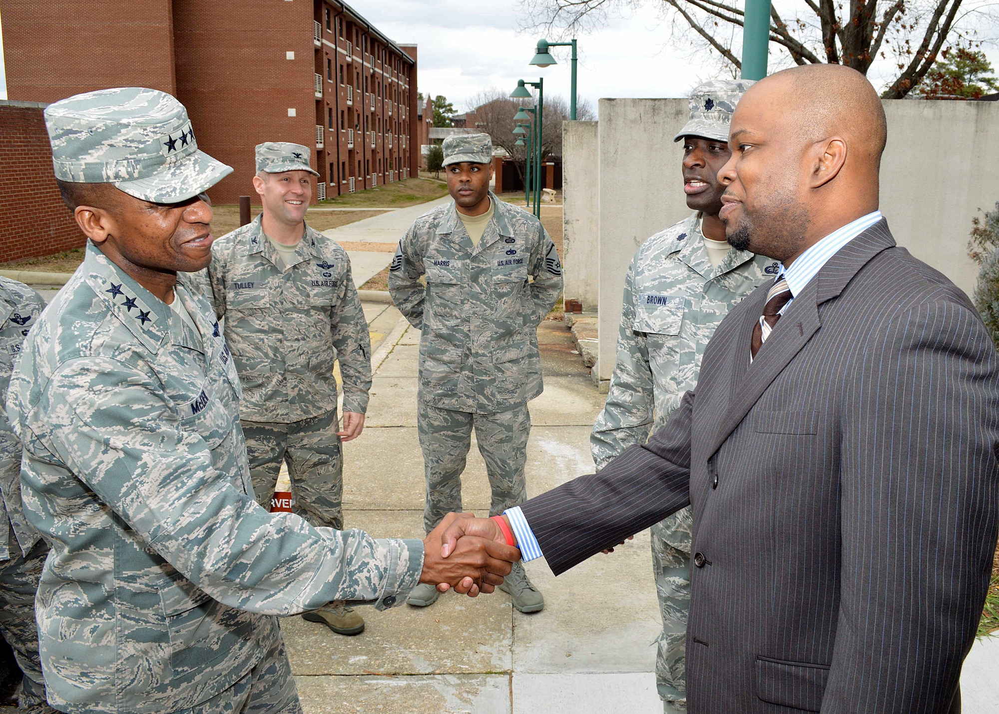 Lt. Gen. Darren McDew, 18th Air Force commander, greets Mr Benjamin Anderson, 43rd Force Support Squadron, during his tour of 43rd Airlift Group units Feb 28.  General McDew visited Pope Army Airfield, N.C. to see first-hand how 43rd Airlift Group Airmen support the Global Response Force mission.
