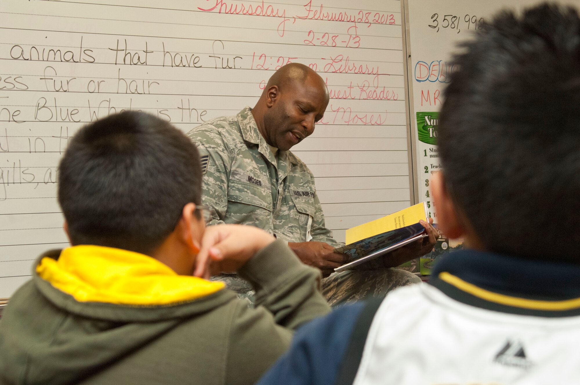 Tech. Sgt. Lee Moses, 99th Logistics Readiness Squadron vehicle operator dispatcher, reads a book to Ms. Susan Thompson’s fifth-grade class for Nevada Reading Week, Feb. 28 at Cortez Elementary School, Las Vegas, Nev.  Modeled after Dr. Seuss’ “Reading Across America”, Nevada Reading Week offers students a chance to be read to from local community members, including Airmen from Nellis Air Force Base. (U.S. Air Force photo by Airman 1st Class Monet Villacorte)