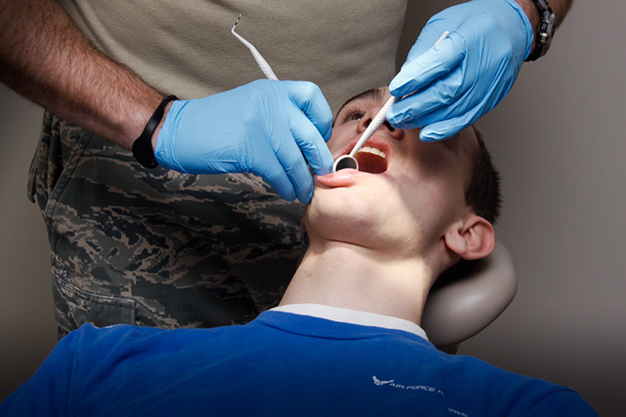 Brendin Peters, son of the 911th Airlift Wing Commander Col. Craig C. Peters, receives a dental check-up during his pre-enlistment physical at the 911th Aeromedical Staging Squadron, Feb. 2, 2013. Brendin, a senior at Poland Seminary High School, will be following in his father’s footsteps when he enlists in the Air Force Reserve this spring. Although his father is a pilot, Brendin will train as a loadmaster and be stationed at Westover Air Reserve Base in Massachusetts after Basic Military Training and Technical School. (U.S. Air Force photo by Senior Airman Justyne Obeldobel/Released)