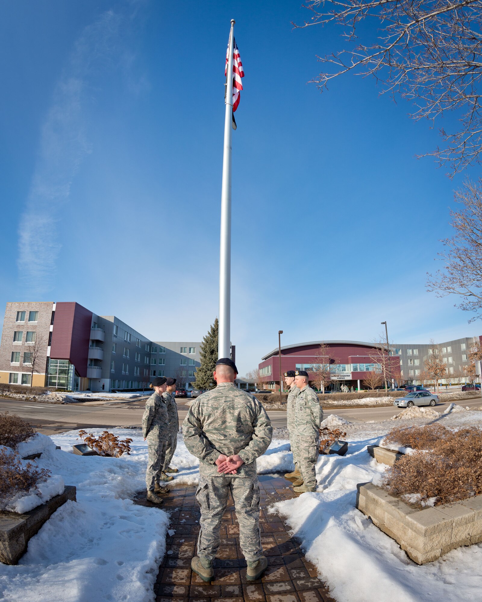 Chief Master Sgt. Jeffrey Imsdahl, Tech. Sgt. James Chadwick, Tech. Sgt. Ryan St. John, Staff Sgt. Benjamin Rosengarded, and Senior Airman Jennifer Heintz, 934th Security Forces Squadron, lower the flag during retreat at the Minneapolis-St. Paul Air Reserve Station, Minn.  (U.S. Air Force photo/Shannon McKay)934th Security Forces Squadron lower the flag during retreat at the Minneapolis-St. Paul Air Reserve Station, Minn.  (U.S. Air Force photo/Shannon McKay)