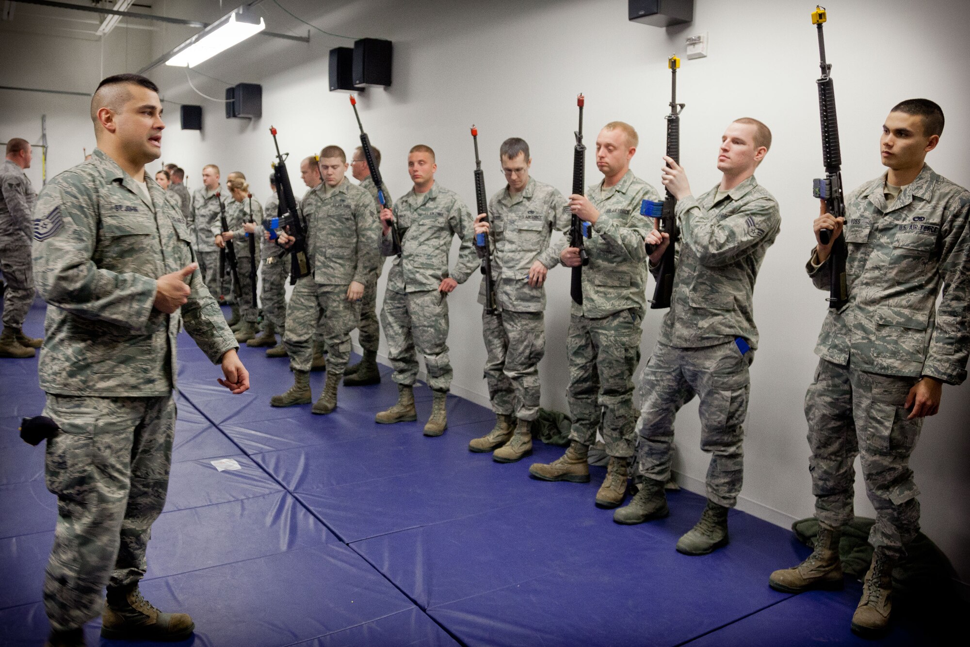 Tech. Sgt. Ryan St. John, 934th Security Forces Squadron, demonstrates weapons familiarization to members of the 934th Airlift Wing.  The weapons issue and clearing training class was held in preparation for the upcoming Operations Readiness Exercise in April.  (U.S. Air Force photo/Shannon McKay)